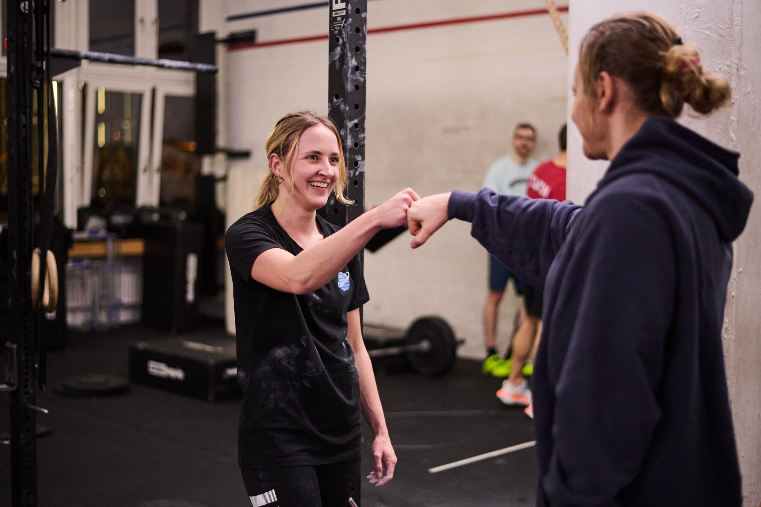 Two girls high-fiving - fitness motivation