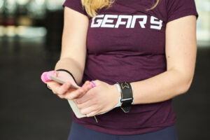 CrossFit athlete fitting grips, demonstrating proper hand care for CrossFit.